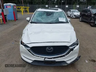 2018 Mazda CX-5 Grand Touring with VIN JM3KFBDM1J0382306, listed as a IAAI auction lot 42554947 with 121,303 mi miles and . Bid and sale history available at DreamBid. Image 6.