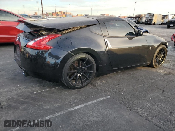 2011 Nissan 370Z Touring with VIN JN1AZ4EH6BM550267, listed as a Copart auction lot 82245804 with 124,466 mi miles and Salvage Title. Bid and sale history available at carsss.com. Image 3.