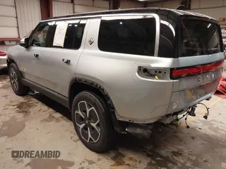 2024 Rivian R1S Adventure with VIN 7PDSGABA9RN039601, listed as a IAAI auction lot 40862472 with 6,186 mi miles. Bid and sale history available at carsss.com. Image 3.