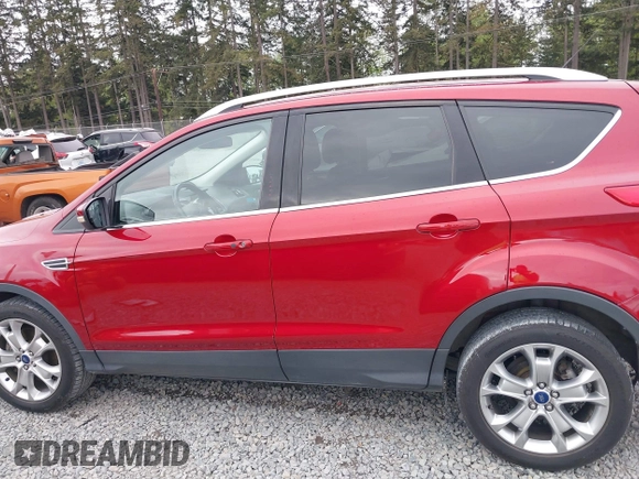 2014 Ford Escape Titanium with VIN 1FMCU9J9XEUD71715, listed as a IAAI auction lot 42127982 with 96,549 mi miles and . Bid and sale history available at DreamBid. Image 14.