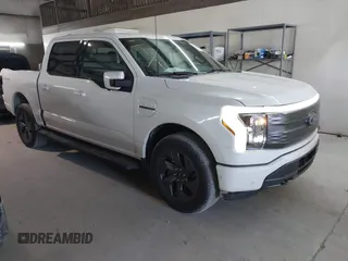 2023 Ford F-150 Lightning Pro with VIN 1FT6W1EV5PWG51022, listed as a IAAI auction lot 41364481 with 10,989 mi miles. Bid and sale history available at carsss.com. Image 1.