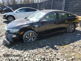 2016 Honda Civic Sedan EX with VIN 19XFC2F74GE233267, listed as a Copart auction lot 50123275 with 70,018 mi miles and Salvage Title. Bid and sale history available at carsss.com. Image 1.