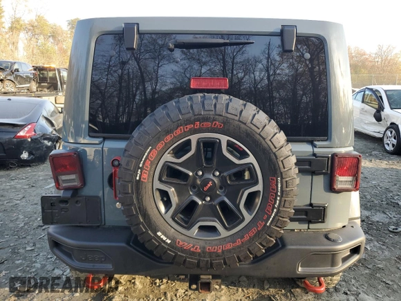2015 Jeep Wrangler Unlimited Rubicon Hard Rock with VIN 1C4HJWFGXFL671660, listed as a Copart auction lot 82329074 with 214,579 mi miles and Salvage title. Bid and sale history available at DreamBid. Image 6.