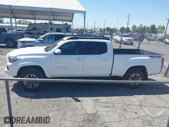 2023 Toyota Tacoma SR5 z VIN 3TMDZ5BN3PM160975, wystawiony jako IAAI lot #42024778 z przebiegiem 41 621 mil mil oraz . Historia ofert i sprzedaży dostępna na DreamBid. Obrazek 13.