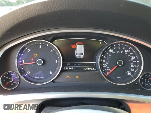 2015 Volkswagen Touareg Lux с VIN WVGEP9BP4FD004212, выставлен на аукционе Copart как лот 54021345 с пробегом 156 164 миль миль и Списание • Salvage title. История ставок и продаж доступна на DreamBid. Изображение 9.