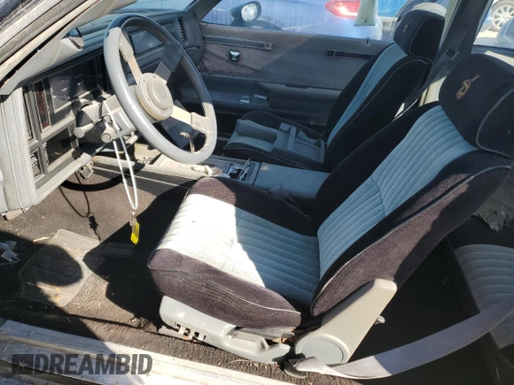 1986 Buick Regal with VIN 1G4GK4774GP228180, listed as a Copart auction lot 76890864 with Not Provided miles and Salvage Title. Bid and sale history available at DreamBid. Image 7.