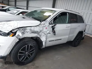 2018 Jeep Grand Cherokee Trailhawk with VIN 1C4RJFLGXJC264438, listed as a IAAI auction lot 40974417 with 117,717 mi miles and . Bid and sale history available at DreamBid. Image 14.