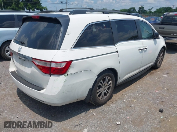 2012 Honda Odyssey EX-L with VIN 5FNRL5H63CB063684, listed as a IAAI auction lot 42576742 with 170,656 mi miles and . Bid and sale history available at DreamBid. Image 4.