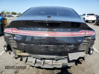 2014 Lincoln MKZ z VIN 3LN6L2GK0ER800286, wystawiony jako Copart lot #57644645 z przebiegiem 130 880 mil mil oraz Szkoda całkowita • Salvage title. Historia ofert i sprzedaży dostępna na DreamBid. Obrazek 6.