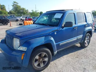 2010 Jeep Liberty Sport with VIN 1J4PN2GK1AW101737, listed as a IAAI auction lot 42003425 with 128,654 mi miles. Bid and sale history available at carsss.com. Image 2.