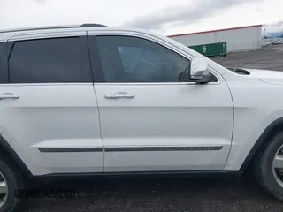 2013 Jeep Grand Cherokee Overland with VIN 1C4RJFCT4DC640553, listed as a IAAI auction lot 41311413 with 146,212 mi miles. Bid and sale history available at carsss.com. Image 14.