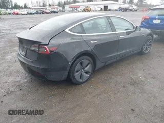 2019 Tesla Model 3 Mid Range with VIN 5YJ3E1EAXKF296378, listed as a IAAI auction lot 41739616 with 77,100 mi miles and . Bid and sale history available at DreamBid. Image 4.