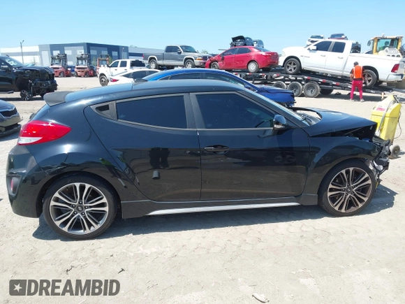 2016 Hyundai Veloster Turbo with VIN KMHTC6AE5GU281597, listed as a IAAI auction lot 42006038 with 77,642 mi miles. Bid and sale history available at carsss.com. Image 14.