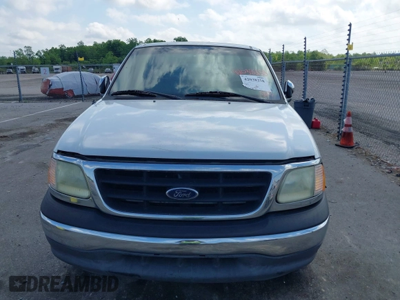 2002 Ford F-150 XL with VIN 1FTRX17242NA69697, listed as a IAAI auction lot 42038258 with 207,008 mi miles. Bid and sale history available at carsss.com. Image 6.
