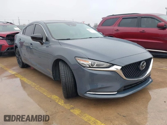 2021 Mazda 6 Carbon Edition with VIN JM1GL1WY0M1600414, listed as a IAAI auction lot 41551393 with 36,780 mi miles and . Bid and sale history available at DreamBid. Image 1.