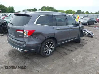 2019 Honda Pilot Touring 8-Passenger with VIN 5FNYF5H93KB028641, listed as a IAAI auction lot 42524078 with 56,744 mi miles and . Bid and sale history available at DreamBid. Image 4.