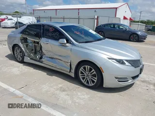 2015 Lincoln MKZ z VIN 3LN6L2GK5FR622117, wystawiony jako IAAI lot #42164455 z przebiegiem 167 156 mil mil oraz . Historia ofert i sprzedaży dostępna na DreamBid. Obrazek 1.