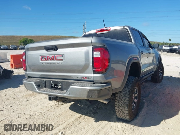 2024 GMC Canyon 4WD AT4X with VIN 1GTP6EEK6R1250127, listed as a IAAI auction lot 41823196 with 1,574 mi miles and . Bid and sale history available at carsss.com. Image 4.