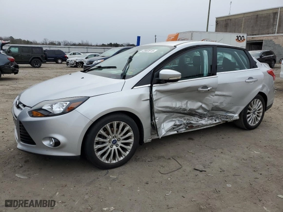2012 Ford Focus Titanium with VIN 1FAHP3J21CL293447, listed as a Copart auction lot 43963615 with 151,448 mi miles and Salvage Title. Bid and sale history available at carsss.com. Image 1.