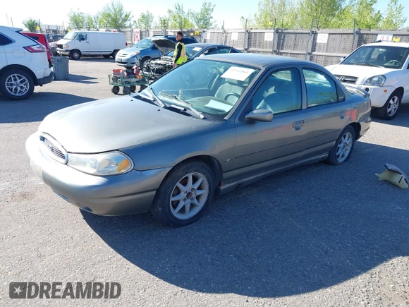 1999 Ford Contour SE Fleet z VIN 1FAFP66L7XK115659, wystawiony jako IAAI lot #42142065 z przebiegiem 161 018 mil mil oraz . Historia ofert i sprzedaży dostępna na DreamBid. Obrazek 2.