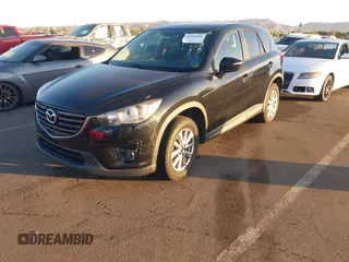 2016 Mazda CX-5 Touring with VIN JM3KE2CY5G0704574, listed as a IAAI auction lot 41033546 with 133,502 mi miles. Bid and sale history available at carsss.com. Image 17.
