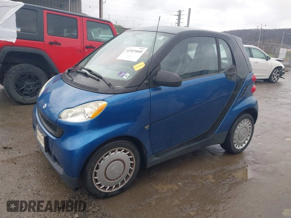 2009 Smart fortwo Pure with VIN WMEEJ31X69K312553, listed as a IAAI auction lot 41957660 with 156,476 mi miles. Bid and sale history available at carsss.com. Image 2.