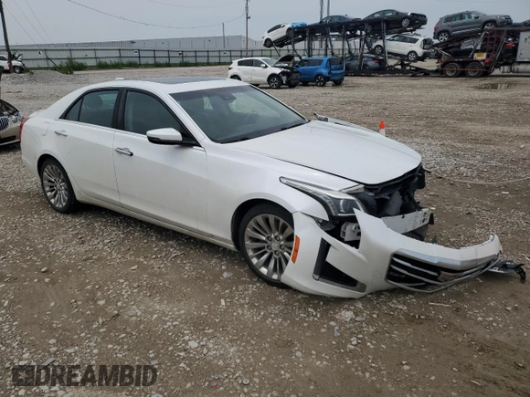 2015 Cadillac CTS Luxury AWD with VIN 1G6AX5SX8F0129784, listed as a Copart auction lot 64955525 with 122,995 mi miles and Clean title. Bid and sale history available at DreamBid. Image 4.