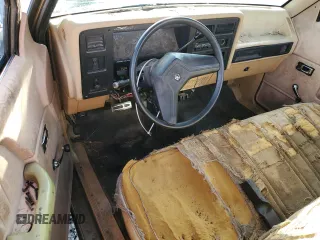 1988 Dodge Dakota z VIN 1B7GN14X5JS776983, wystawiony jako Copart lot #76597944 z przebiegiem 133 654 mil mil oraz Czysty tytuł • Clean title. Historia ofert i sprzedaży dostępna na DreamBid. Obrazek 8.