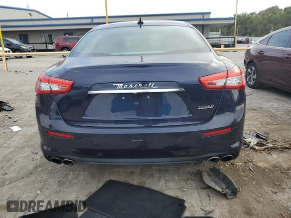 2018 Maserati Ghibli z VIN ZAM57XSA5J1287424, wystawiony jako Copart lot #71215154 z przebiegiem 20 029 mil mil oraz Szkoda całkowita • Salvage title. Historia ofert i sprzedaży dostępna na DreamBid. Obrazek 6.