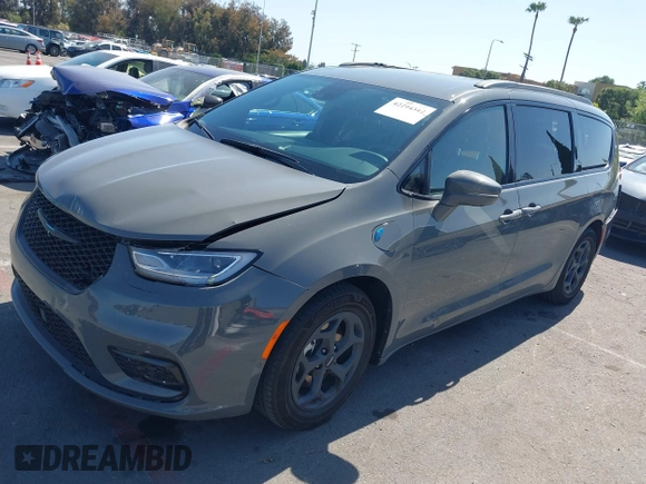 2021 Chrysler Pacifica Hybrid Limited z VIN 2C4RC1S76MR544495, wystawiony jako IAAI lot #42294312 z przebiegiem 89 083 mil mil oraz . Historia ofert i sprzedaży dostępna na DreamBid. Obrazek 18.