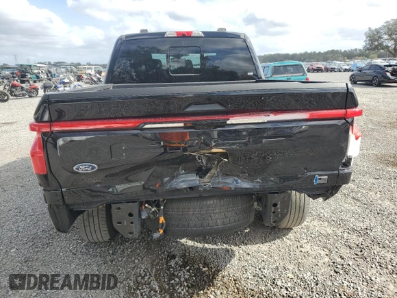2022 Ford F-150 Lightning Pro z VIN 1FT6W1EV4NWG14041, wystawiony jako Copart lot #85252844 z przebiegiem 31 093 mil mil oraz Szkoda całkowita • Salvage title. Historia ofert i sprzedaży dostępna na DreamBid. Obrazek 6.
