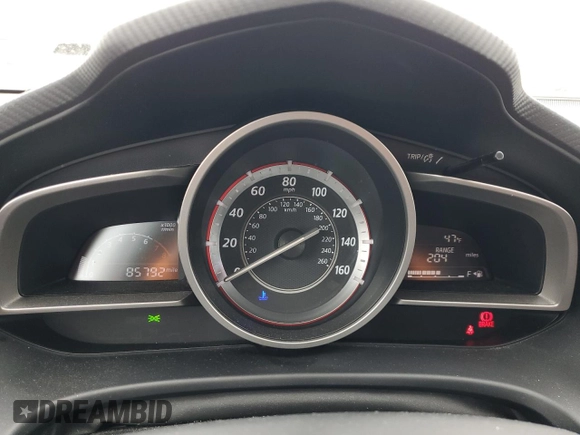 2014 Mazda 3 i SV with VIN JM1BM1T74E1148567, listed as a Copart auction lot 50977115 with 85,792 mi miles and Salvage Title. Bid and sale history available at DreamBid. Image 9.
