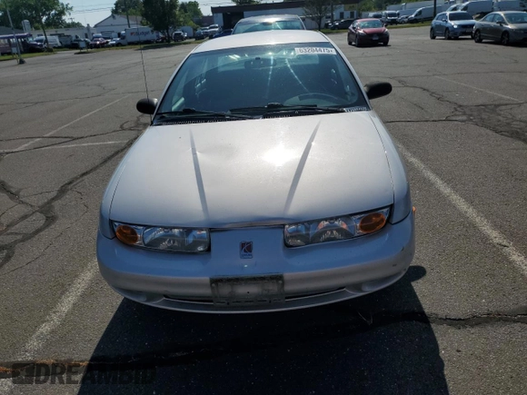 2000 Saturn SL z VIN 1G8ZK5279YZ252761, wystawiony jako Copart lot #63204475 z przebiegiem 80 646 mil mil oraz Czysty tytuł • Clean title. Historia ofert i sprzedaży dostępna na DreamBid. Obrazek 5.