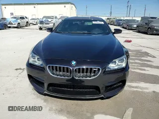 2014 BMW M6 z VIN WBS6C9C51EDV73883, wystawiony jako Copart lot #76395574 z przebiegiem 57 995 mil mil oraz Czysty tytuł • Clean title. Historia ofert i sprzedaży dostępna na DreamBid. Obrazek 14.