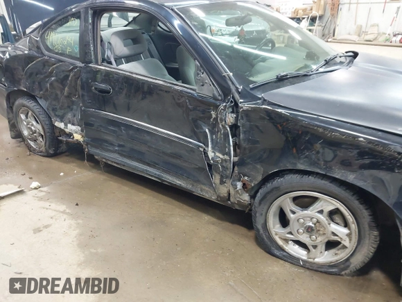 2005 Pontiac Grand Am GT with VIN 1G2NW12E85M140434, listed as a IAAI auction lot 41966294 with 142,548 mi miles. Bid and sale history available at carsss.com. Image 6.