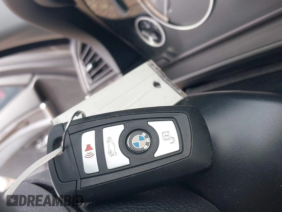 2014 BMW 5 Series 528i xDrive with VIN WBA5A7C55ED617099, listed as a IAAI auction lot 42003348 with 85,262 mi miles and . Bid and sale history available at DreamBid. Image 11.