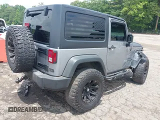 2016 Jeep Wrangler Black Bear with VIN 1C4AJWAG5GL258426, listed as a IAAI auction lot 42400914 with 128,606 mi miles and . Bid and sale history available at DreamBid. Image 4.