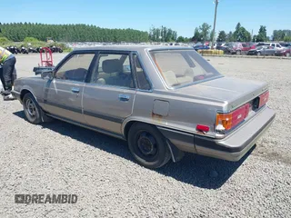 1986 Toyota Camry z VIN JT2SV16E1G0439200, wystawiony jako IAAI lot #42395141 z przebiegiem 159 698 mil mil oraz . Historia ofert i sprzedaży dostępna na DreamBid. Obrazek 3.