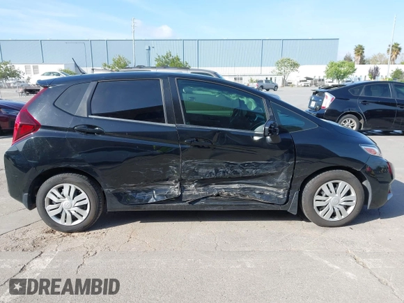 2015 Honda Fit LX with VIN 3HGGK5G5XFM737172, listed as a IAAI auction lot 42053332 with 80,690 mi miles. Bid and sale history available at carsss.com. Image 13.