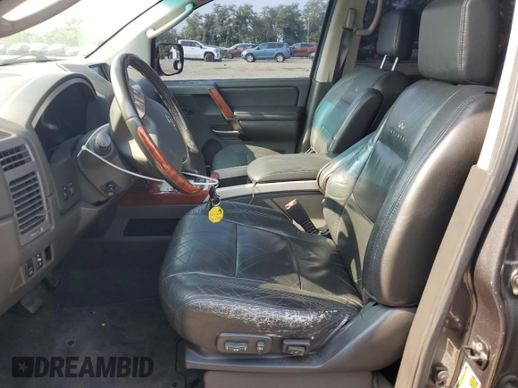 2004 Infiniti QX56 with VIN 5N3AA08C34N803087, listed as a Copart auction lot 67706944 with 170,095 mi miles and Salvage Title. Bid and sale history available at carsss.com. Image 7.