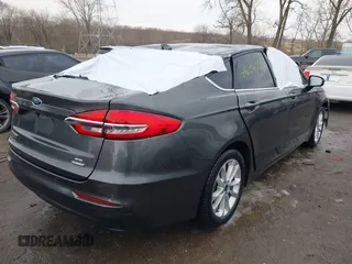 2020 Ford Fusion SE z VIN 3FA6P0LU6LR185721, wystawiony jako IAAI lot #41639827 z przebiegiem 63 857 mil mil oraz . Historia ofert i sprzedaży dostępna na DreamBid. Obrazek 4.