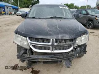2012 Dodge Journey SXT z VIN 3C4PDCBG2CT314562, wystawiony jako Copart lot #57500195 z przebiegiem 156 319 mil mil oraz Szkoda całkowita • Salvage title. Historia ofert i sprzedaży dostępna na DreamBid. Obrazek 5.