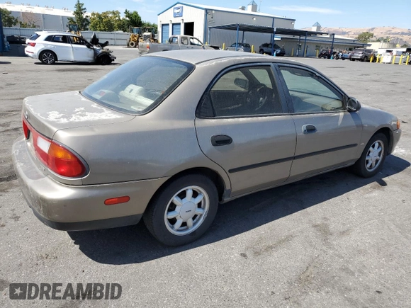 1998 Mazda Protege DX z VIN JM1BC1414W0203670, wystawiony jako Copart lot #62966544 z przebiegiem 249 405 mil mil oraz Szkoda całkowita • Salvage title. Historia ofert i sprzedaży dostępna na DreamBid. Obrazek 3.