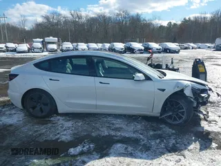 2023 Tesla Model 3 Long Range with VIN 5YJ3E1EBXPF392818, listed as a IAAI auction lot 41346835 with 31,750 mi miles and . Bid and sale history available at DreamBid. Image 13.