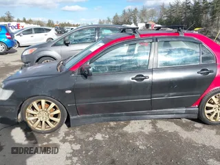 2003 Mitsubishi Lancer OZ-Rally with VIN JA3AJ86E03U078826, listed as a IAAI auction lot 41700333 with 119,656 mi miles. Bid and sale history available at carsss.com. Image 6.