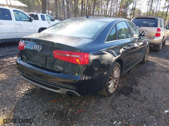 2014 Audi A6 3.0T Prestige with VIN WAUHGAFC8EN142187, listed as a IAAI auction lot 41833457 with 129,533 mi miles. Bid and sale history available at carsss.com. Image 4.