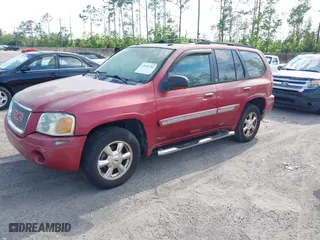 2004 GMC Envoy SLT with VIN 1GKDS13SX42334503, listed as a IAAI auction lot 42038781 with 242,680 mi miles. Bid and sale history available at carsss.com. Image 2.