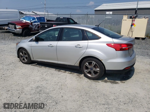 2016 Ford Focus SE with VIN 1FADP3FE8GL353103, listed as a Copart auction lot 64972865 with 131,403 mi miles and Clean title. Bid and sale history available at DreamBid. Image 2.