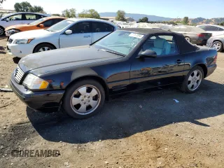 1999 Mercedes-Benz SL-Class with VIN WDBFA68F8XF186072, listed as a Copart auction lot 69557094 with 99,691 mi miles and Salvage Title. Bid and sale history available at carsss.com. Image 1.