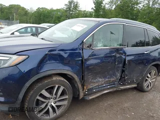 2017 Honda Pilot Touring with VIN 5FNYF6H99HB093136, listed as a IAAI auction lot 42507326 with 125,579 mi miles and . Bid and sale history available at DreamBid. Image 6.